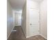 Bright entryway with neutral walls and carpeted floors at 280 Green Commons Dr, Covington, GA 30016