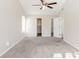 Spacious primary bedroom with plush carpet and ample closet space at 280 Green Commons Dr, Covington, GA 30016