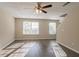 Living room with hardwood floors and large windows at 280 Green Commons Dr, Covington, GA 30016