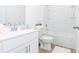 Clean bathroom featuring a shower/tub combo, white vanity, and wood-look flooring at 1639 Winpost Nw Ln, Atlanta, GA 30318