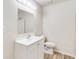 Simple bathroom with white vanity and shower at 6085 Hotel St, Austell, GA 30106
