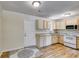 Updated kitchen with wood cabinets and granite countertops at 6085 Hotel St, Austell, GA 30106