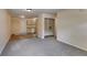 Bright living room featuring gray carpet and kitchen access at 6085 Hotel St, Austell, GA 30106