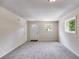 Simple living room with gray carpet and natural light at 6085 Hotel St, Austell, GA 30106