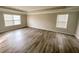 Spacious main bedroom with hardwood floors and multiple windows at 925 Pegasus Way, Atlanta, GA 30349