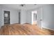 Well-lit bedroom with hardwood floors, and access to bathroom and kitchen at 1630 Ezra Church Nw Dr, Atlanta, GA 30314