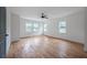 Spacious bedroom with hardwood floors and ceiling fan at 1630 Ezra Church Nw Dr, Atlanta, GA 30314