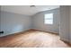 Bright bedroom with hardwood floors and gray walls at 1630 Ezra Church Nw Dr, Atlanta, GA 30314