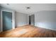 Well-lit bedroom with hardwood floors and gray walls at 1630 Ezra Church Nw Dr, Atlanta, GA 30314
