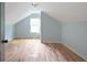 Spacious bedroom with hardwood floors and a dormer window at 1630 Ezra Church Nw Dr, Atlanta, GA 30314