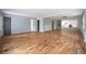 Open living area with hardwood floors and a view into the kitchen at 1630 Ezra Church Nw Dr, Atlanta, GA 30314