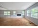 Open concept living room with hardwood floors and a fireplace at 1630 Ezra Church Nw Dr, Atlanta, GA 30314