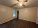 Simple bedroom with wood-look floors and ceiling fan at 9151 Spillers Sw Dr, Covington, GA 30014