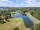 Aerial view of a community lake with a fountain at 129 Gold Mill Pl, Canton, GA 30114