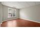 Bright basement room with large window and wood flooring at 129 Gold Mill Pl, Canton, GA 30114