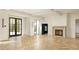 Spacious living area with herringbone floors, fireplace, and French doors at 8350 Farmette Bnd, Chattahoochee Hills, GA 30268