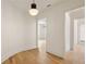 Bright hallway with hardwood floors and curved shiplap wall at 8350 Farmette Bnd, Chattahoochee Hills, GA 30268