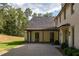 A covered patio provides outdoor space and access from the main house at 8350 Farmette Bnd, Chattahoochee Hills, GA 30268