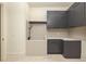 Modern laundry room with gray cabinetry and a built-in pet bath at 8350 Farmette Bnd, Chattahoochee Hills, GA 30268