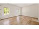 Bright bedroom featuring hardwood floors and natural light at 8350 Farmette Bnd, Chattahoochee Hills, GA 30268