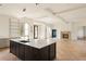 Open concept kitchen with large island and herringbone floors at 8350 Farmette Bnd, Chattahoochee Hills, GA 30268
