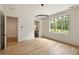 Light-filled bedroom with hardwood floors and large window at 8350 Farmette Bnd, Chattahoochee Hills, GA 30268