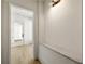 Light-filled entry hall with built-in bench and access to exterior at 8350 Farmette Bnd, Chattahoochee Hills, GA 30268
