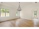 Bright bedroom with hardwood floors and large windows at 8350 Farmette Bnd, Chattahoochee Hills, GA 30268