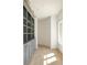 Built-in gray library shelving and cabinetry at 8350 Farmette Bnd, Chattahoochee Hills, GA 30268