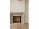 Modern fireplace with herringbone tile and wood flooring at 8350 Farmette Bnd, Chattahoochee Hills, GA 30268
