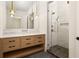 Spa-like bathroom with marble shower and modern vanity at 8350 Farmette Bnd, Chattahoochee Hills, GA 30268