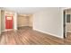 Open living room with hardwood floors and red front door at 2354 Woodhill Ln, Atlanta, GA 30344