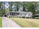 Charming ranch home with screened porch and landscaped yard at 2354 Woodhill Ln, Atlanta, GA 30344