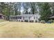 Front view of a ranch home with a spacious lawn at 2354 Woodhill Ln, Atlanta, GA 30344