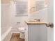 Clean bathroom with white tile and granite countertop at 2354 Woodhill Ln, Atlanta, GA 30344