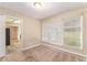 Dining room with large windows and kitchen access at 2354 Woodhill Ln, Atlanta, GA 30344
