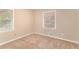 Well-lit bedroom with neutral walls and carpeted floors at 2354 Woodhill Ln, Atlanta, GA 30344