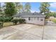 Rear view of the house showcasing the patio and yard at 2354 Woodhill Ln, Atlanta, GA 30344