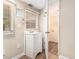 Simple bathroom with a pedestal sink and laundry area at 2354 Woodhill Ln, Atlanta, GA 30344