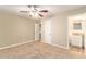 Spacious main bedroom with ceiling fan and en-suite bathroom access at 2354 Woodhill Ln, Atlanta, GA 30344