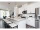 Modern kitchen with white cabinets, quartz countertops, and stainless steel appliances at 355 Skylar Se Way, Atlanta, GA 30315