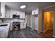 Modern kitchen with white cabinets, quartz countertops and stainless steel appliances at 1077 Memory Ln, Lawrenceville, GA 30044