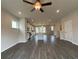 Open concept living room with hardwood floors and kitchen views at 3370 Reagan Way # 84, Lawrenceville, GA 30044