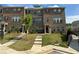 Brick townhome with a charming front yard and walkway at 3370 Reagan Way # 84, Lawrenceville, GA 30044