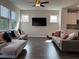 Spacious living room with hardwood floors and sectional sofa at 3370 Reagan Way # 84, Lawrenceville, GA 30044