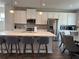 Modern kitchen with white cabinets, quartz countertops, and island seating at 3370 Reagan Way # 84, Lawrenceville, GA 30044