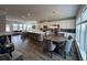 Open concept kitchen and living area with island and dining table at 3370 Reagan Way # 84, Lawrenceville, GA 30044