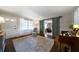 Bright entryway with barn doors opening to the living room, hardwood floors, and natural light at 4271 Hiram Lithia Springs Rd, Powder Springs, GA 30127