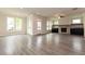 Spacious living room with hardwood floors and a fireplace at 2743 Evanshire Ave, Duluth, GA 30096