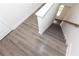 Modern stairs with light gray wooden steps at 2743 Evanshire Ave, Duluth, GA 30096